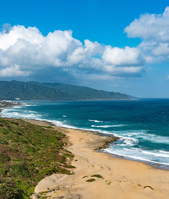 Scenic coastline and shallow fringing coral reefs at Hideaway Bay near Cape Gloucester.